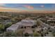 Aerial view of home highlighting its unique architecture and desert landscape at 10751 E Candlewood Dr, Scottsdale, AZ 85255