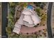 Aerial view of home, showcasing a unique architectural design, pool and spa at 10751 E Candlewood Dr, Scottsdale, AZ 85255