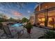 Spacious backyard with pool, lounge chairs, and mountain views at 10751 E Candlewood Dr, Scottsdale, AZ 85255