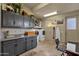 Spacious laundry room with washer, dryer, and extra storage at 10751 E Candlewood Dr, Scottsdale, AZ 85255