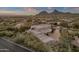 Aerial view showing the home's architecture and expansive desert views at 10751 E Candlewood Dr, Scottsdale, AZ 85255