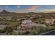 Aerial view of house with mountain views and a beautiful pool at 10751 E Candlewood Dr, Scottsdale, AZ 85255
