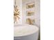 Stunning bathroom with a freestanding tub and gold accents at 7157 E Rancho Vista Dr # 3006, Scottsdale, AZ 85251