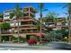Upscale condo building with palm trees and street view at 7157 E Rancho Vista Dr # 3006, Scottsdale, AZ 85251