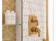 Gold shower fixtures and mosaic tile detail in the shower at 7157 E Rancho Vista Dr # 3006, Scottsdale, AZ 85251