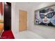 Modern entryway with large artwork and a red bench at 7157 E Rancho Vista Dr # 3006, Scottsdale, AZ 85251