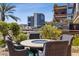 Relaxing patio with fire pit, seating area, and city views at 7157 E Rancho Vista Dr # 3006, Scottsdale, AZ 85251