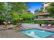 Community pool with lounge chairs and BBQ grills at 7157 E Rancho Vista Dr # 3006, Scottsdale, AZ 85251