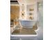 Spa-like bathroom with a freestanding tub, elegant lighting, and marble finishes at 7157 E Rancho Vista Dr # 3006, Scottsdale, AZ 85251