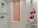 Spa-like shower with a peach mosaic tile accent wall at 7157 E Rancho Vista Dr # 3006, Scottsdale, AZ 85251