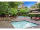 Outdoor pool and spa with lounge chairs and BBQ area at 7157 E Rancho Vista Dr # 3006, Scottsdale, AZ 85251