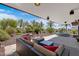 Outdoor patio with comfortable seating, lush landscaping, and a TV at 7157 E Rancho Vista Dr # 3006, Scottsdale, AZ 85251
