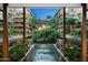 Luxurious courtyard with a central fountain, lush landscaping, and seating areas at 7157 E Rancho Vista Dr # 3006, Scottsdale, AZ 85251
