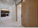 Bright hallway with marble floors and a barn door at 29646 N 109Th Pl # 128, Scottsdale, AZ 85262