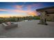 Spacious patio with fire pit and views of the pool and desert landscape at 29646 N 109Th Pl # 128, Scottsdale, AZ 85262