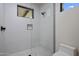 Modern bathroom with a frameless glass shower and white tile at 29646 N 109Th Pl # 128, Scottsdale, AZ 85262