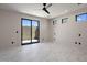 Bright bedroom with marble floors and sliding glass doors at 29646 N 109Th Pl # 128, Scottsdale, AZ 85262