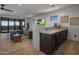 Wet bar with wine cooler and stone countertop at 29646 N 109Th Pl # 128, Scottsdale, AZ 85262
