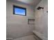 Modern shower with built-in bench and window at 29646 N 109Th Pl # 128, Scottsdale, AZ 85262