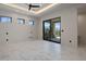 Bright bedroom with marble floors and sliding glass doors at 29646 N 109Th Pl # 128, Scottsdale, AZ 85262