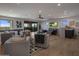 Spacious game room with bar, seating area, and wood floors at 29646 N 109Th Pl # 128, Scottsdale, AZ 85262