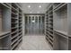 Spacious walk-in closet with ample shelving and drawers at 29646 N 109Th Pl # 128, Scottsdale, AZ 85262