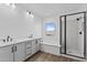 Elegant bathroom featuring dual sinks, a soaking tub, and a walk-in shower at 22782 E Stacey Rd, Queen Creek, AZ 85142