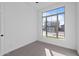 Bright bedroom with large window and neutral-toned carpet at 22782 E Stacey Rd, Queen Creek, AZ 85142