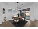 Dining area with wooden table, chairs, and access to backyard at 22782 E Stacey Rd, Queen Creek, AZ 85142