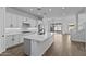 Modern kitchen with white cabinets, quartz countertops, and an island at 22782 E Stacey Rd, Queen Creek, AZ 85142