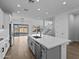 Open concept kitchen with island, stainless steel appliances, and access to backyard at 22782 E Stacey Rd, Queen Creek, AZ 85142