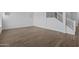 Open living area with hardwood floors and a staircase at 22782 E Stacey Rd, Queen Creek, AZ 85142