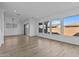 Spacious living area with hardwood floors and sliding glass doors at 22782 E Stacey Rd, Queen Creek, AZ 85142