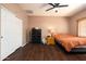 Main bedroom with dark wood floors, large closet, and a bed at 3911 S Laurel Way, Chandler, AZ 85286