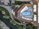 Aerial view showing a resort-style pool and surrounding landscape at 7175 E Camelback Rd # 704, Scottsdale, AZ 85251