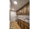Laundry room with granite countertop and ample cabinetry at 7175 E Camelback Rd # 704, Scottsdale, AZ 85251