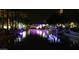 Night view of a canal with light installations reflecting in the water at 7175 E Camelback Rd # 704, Scottsdale, AZ 85251