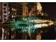 Night view of a canal with lights reflecting on the water at 7175 E Camelback Rd # 704, Scottsdale, AZ 85251