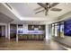 Open kitchen with island, granite countertops and hardwood floors at 7175 E Camelback Rd # 704, Scottsdale, AZ 85251