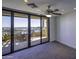 Bedroom with city view and access to a private balcony at 7175 E Camelback Rd # 704, Scottsdale, AZ 85251