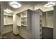 Spacious walk-in closet with built-in shelving at 7175 E Camelback Rd # 704, Scottsdale, AZ 85251