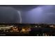 Lightning storm over city skyline at night at 7175 E Camelback Rd # 704, Scottsdale, AZ 85251