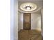 Elegant entryway with hardwood floors and a unique ceiling fixture at 7175 E Camelback Rd # 704, Scottsdale, AZ 85251
