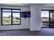 Bedroom with large windows, city views and access to a private balcony at 7175 E Camelback Rd # 704, Scottsdale, AZ 85251