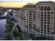 Luxury building overlooking a canal with city and mountain views at 7175 E Camelback Rd # 704, Scottsdale, AZ 85251