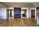 Living room with modern fireplace and hardwood floors at 7175 E Camelback Rd # 704, Scottsdale, AZ 85251