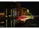 Night view of canal with buildings and festive lights reflected in the water at 7175 E Camelback Rd # 704, Scottsdale, AZ 85251