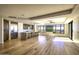 Open concept kitchen and living area with hardwood floors at 7175 E Camelback Rd # 704, Scottsdale, AZ 85251