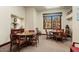Bright and airy community room with two tables and chairs at 14950 W Mountain View Blvd # 5101, Surprise, AZ 85374