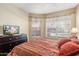 Bedroom with a king bed and views of the courtyard at 14950 W Mountain View Blvd # 5101, Surprise, AZ 85374
